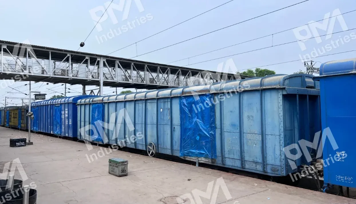 BCN Wagon Waterproofing with Tarpaulin Sheet at a Railway Platform